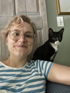 Image of a happy person with their cat.