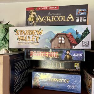 Photo of a stack of board games.